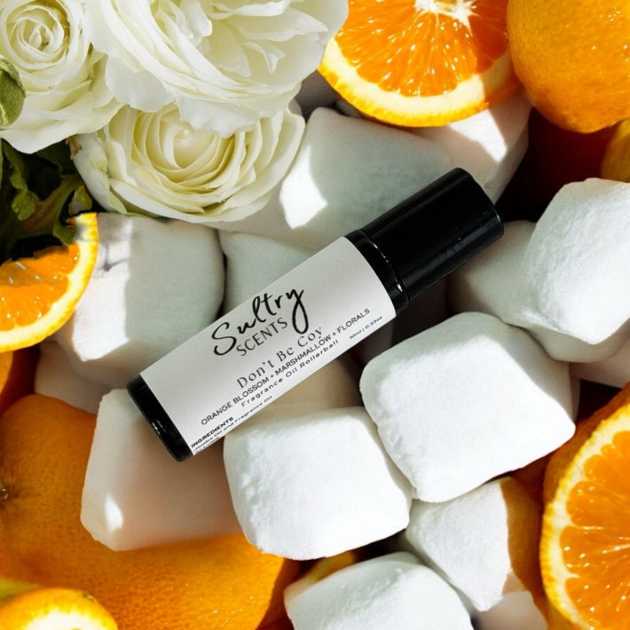 Designer Inspired Roll On Perfume. Luxury for less. Inspired by Carolina Herrera Love, Don't be Shy. Luxury fragrances for less. Designer fragrances for less. Kansas City fragrance business. Handcrafted in Platte City, MO. Designer inspired for less. Roll on perfume with notes of marshmallow, orange and white florals.