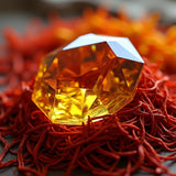 Sultry Scents Baccarat Rouge 540 dupe body spray bottle shaped like a golden faceted gem on red threads