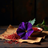 Black Saffron dupe roll on perfume inspired by saffron threads and purple flower on fabric