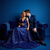 Elegant couple dressed in blue formal attire conveying sophistication for Bleu de Chanel dupe roll on perfume