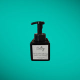 Sultry Scents Breathtaking citrus sandalwood foaming hand soap in a black pump bottle