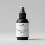 Sultry Scents Breathtaking odor eliminating room spray with bergamot, citrus, and sandalwood scent in black bottle