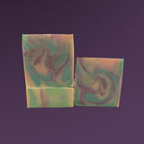 Sultry Scents butterfly pea flower soap bars with green and purple swirled design on a purple background