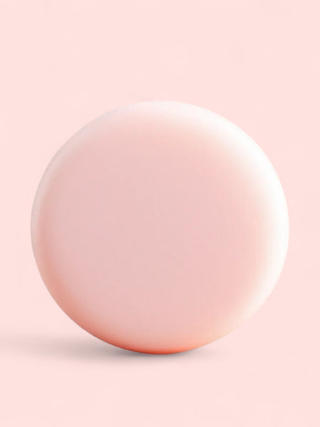 Sultry Scents pale pink round Sulfate free clarifying Solid Shampoo Bar on soft pink background