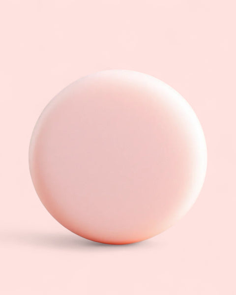 Sultry Scents pale pink round Sulfate free clarifying Solid Shampoo Bar on soft pink background