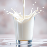 Glass of milk with splash effect representing Commodity Milk dupe body spray by Sultry Scents