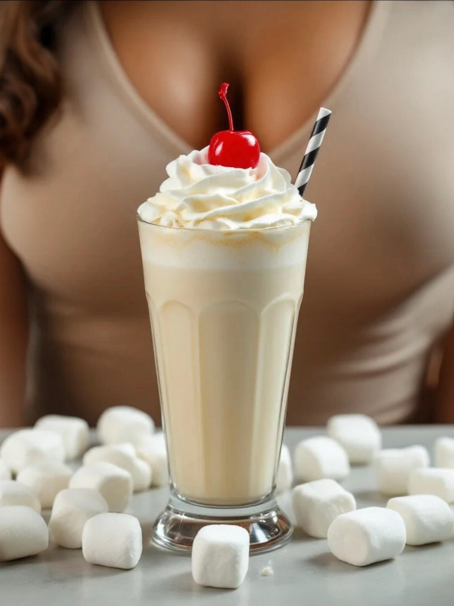 Commodity Milk inspired roll on perfume displayed next to a milkshake topped with whipped cream and a cherry