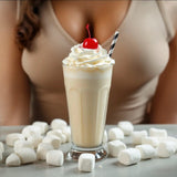 Commodity Milk inspired roll on perfume displayed next to a milkshake topped with whipped cream and a cherry