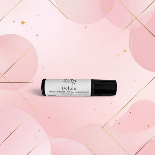 Vanilla perfume oil inspired by Kayali Vanilla 28 by Sultry Scents in a black capped roller bottle on pink background