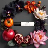 Euphoric roll on perfume inspired by CK Euphoria, surrounded by vibrant flowers and fruits