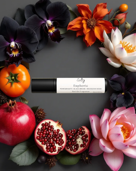Euphoric roll on perfume inspired by CK Euphoria, surrounded by vibrant flowers and fruits