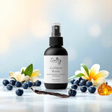 Sultry Scents Golden Hour body spray surrounded by vanilla, blueberries, amber, and flowers gentle fluidity gold dupe body spray
