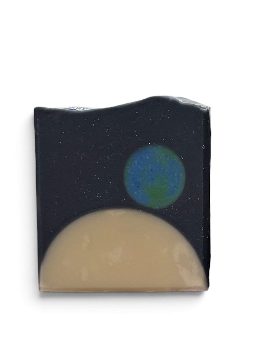 Glossier You inspired soap bar designed with a cosmic theme showcasing Earth and the moon