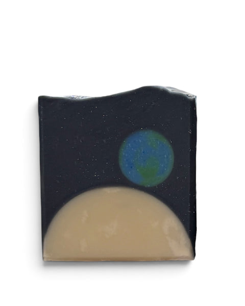 Glossier You inspired soap bar designed with a cosmic theme showcasing Earth and the moon