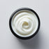 Open container showing smooth white goat milk body cream with creamy texture by Sultry Scents