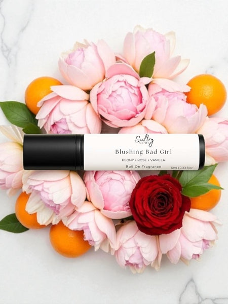 Sultry Scents Good Girl Blush inspired roll on perfume with floral elements on a marble background