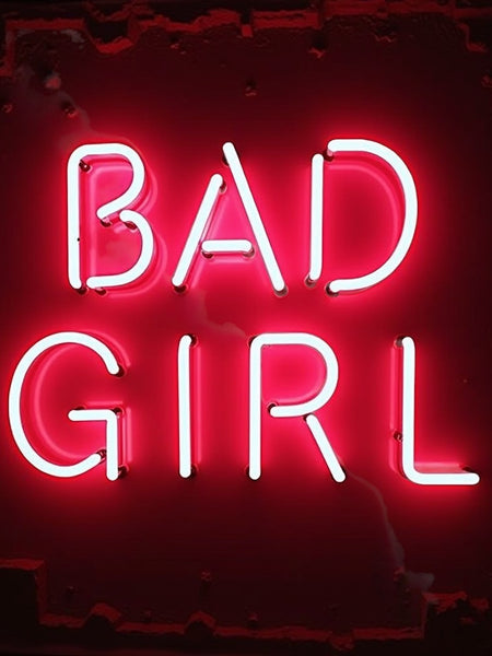 Sultry Scents Good girl dupe roll-on perfume with bold bad girl neon sign background