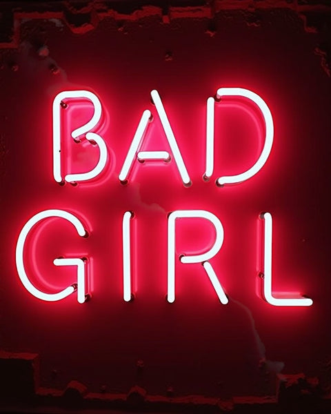 Sultry Scents Good girl dupe roll-on perfume with bold bad girl neon sign background