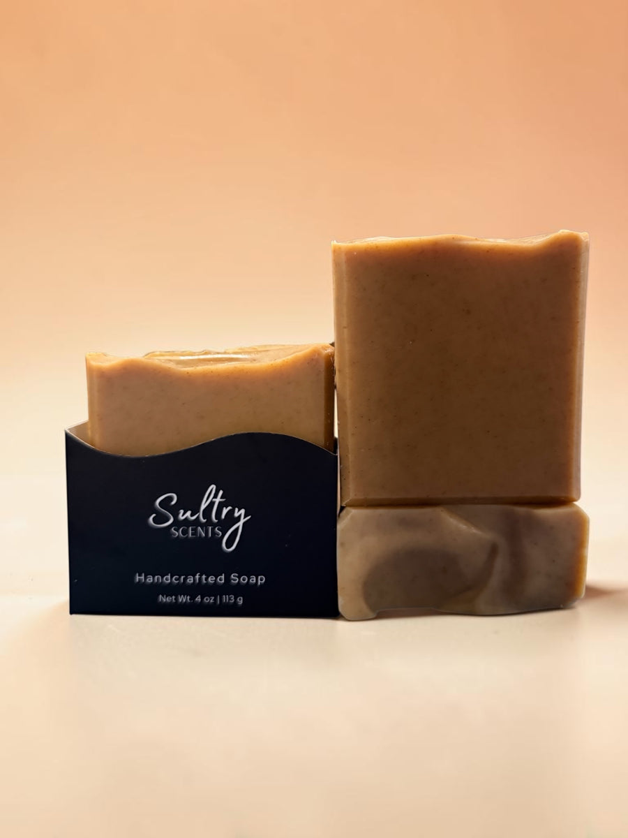 Two bars of Sultry Scents handcrafted turmeric soap made with tallow in natural light