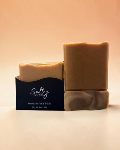 Two bars of Sultry Scents handcrafted turmeric soap made with tallow in natural light