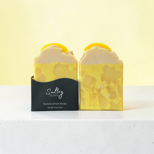 Lemon scented soap bar inspired by Under the Lemon Tree with vibrant yellow swirls and fresh lemon design