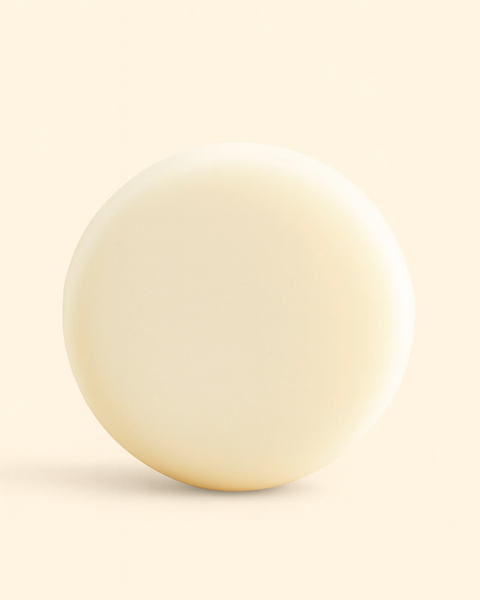 Sultry Scents luxury solid conditioner bar in a creamy white color for moisturizing hair care