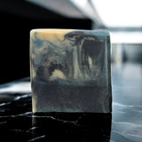 Mens soap inspired by YSL Myslf with black and beige marbled design on dark surface