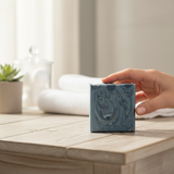 Mont Blanc Legend Inspired Soap in a blue swirl design placed on a wooden table with towels and decor
