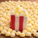 Novelty Popcorn Soap Bar with realistic popcorn topping, surrounded by popcorn kernels for a playful touch