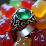 Phlur mood ring dupe roll on fragrance inspired green mood ring surrounded by colorful gummy bears