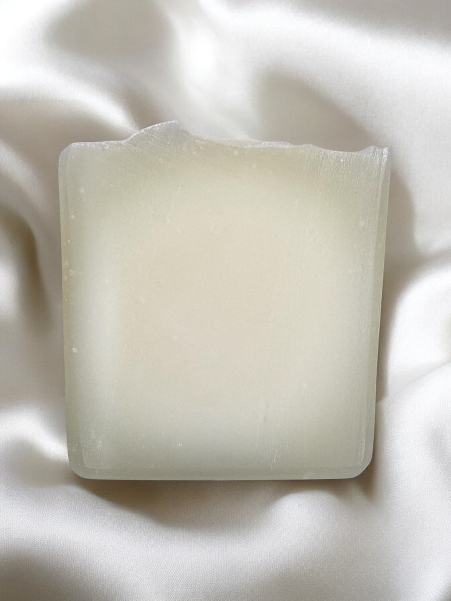 Pure tallow handcrafted soap bar with a smooth texture placed on soft fabric