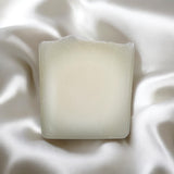 Pure tallow handcrafted soap bar with a smooth texture placed on soft fabric