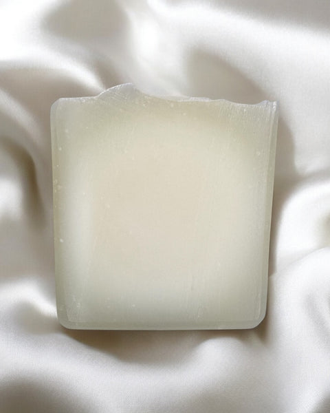 Pure tallow handcrafted soap bar with a smooth texture placed on soft fabric