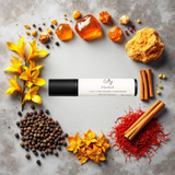 Santal Blush inspired roll on perfume by Sultry Scents surrounded by spices and floral elements
