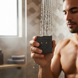 Man using Sex Panther inspired soap in the shower with water droplets on the bar