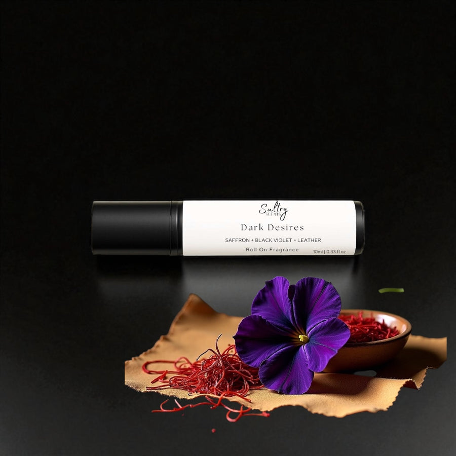 Sultry Scents Black Saffron dupe roll on perfume with dark violet flower and saffron threads on black background