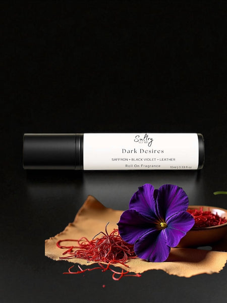 Sultry Scents Black Saffron dupe roll on perfume with dark violet flower and saffron threads on black background