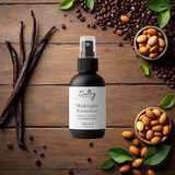 Sultry Scents Midnight Essence black bottle surrounded by vanilla beans coffee and almonds Black Opium inspired body spray