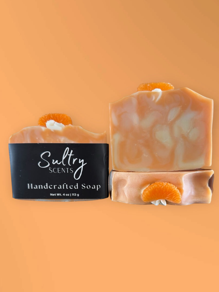 Blue Volcano inspired soap Serendipity handcrafted by Sultry Scents with orange slice decoration