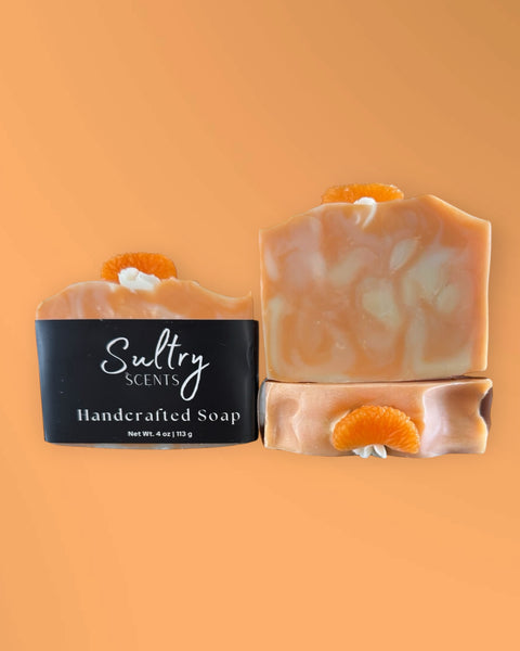 Blue Volcano inspired soap Serendipity handcrafted by Sultry Scents with orange slice decoration