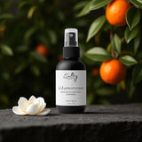Sultry Scents Glamorous room spray bottle with gardenia blossom and oranges on branch Boutique Hotel Inspired Room Spray