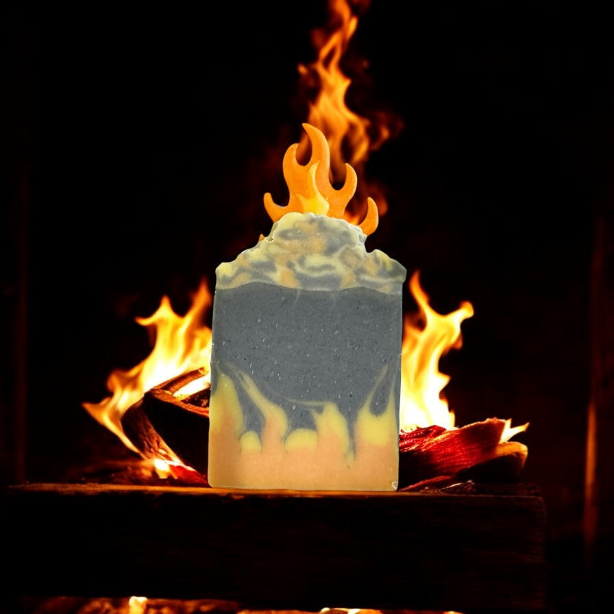 By the fire inspired soap bar with flame design in front of burning wood fire