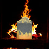 By the fire inspired soap bar with flame design in front of burning wood fire