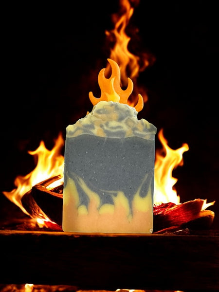 By the fire inspired soap bar with flame design in front of burning wood fire