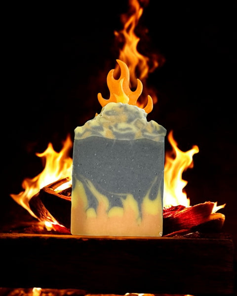 By the fire inspired soap bar with flame design in front of burning wood fire
