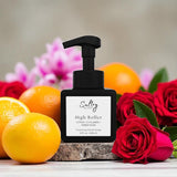 Sultry Scents High Roller black pump bottle surrounded by citrus, cyclamen, and red roses Caesars Palace inspired foaming hand soap
