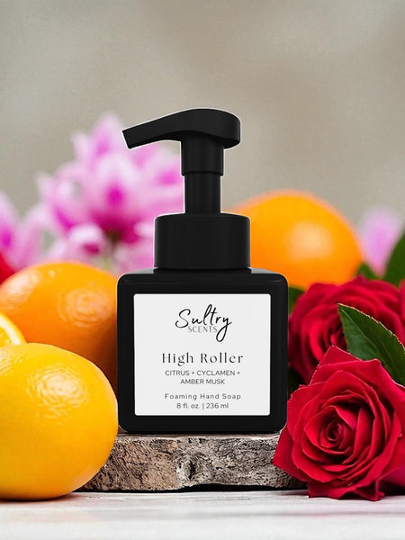 Sultry Scents High Roller black pump bottle surrounded by citrus, cyclamen, and red roses Caesars Palace inspired foaming hand soap