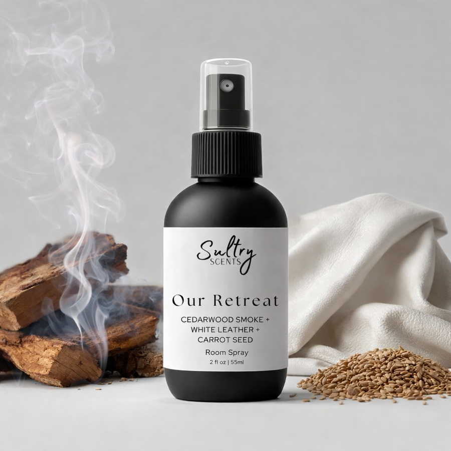 Cedarwood leather room spray from Sultry Scents with natural wood backdrop and smoke effect
