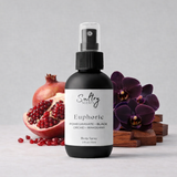 Sultry Scents CK Euphoria inspired body spray in a black bottle with pomegranate and orchid flowers