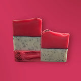 Sultry Scents Dragon Fruit Soap Bar with pink and white layers and black seeds on pink background
